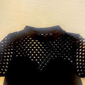 Venus sexy stretch mock neck. See through knit arm and bust.